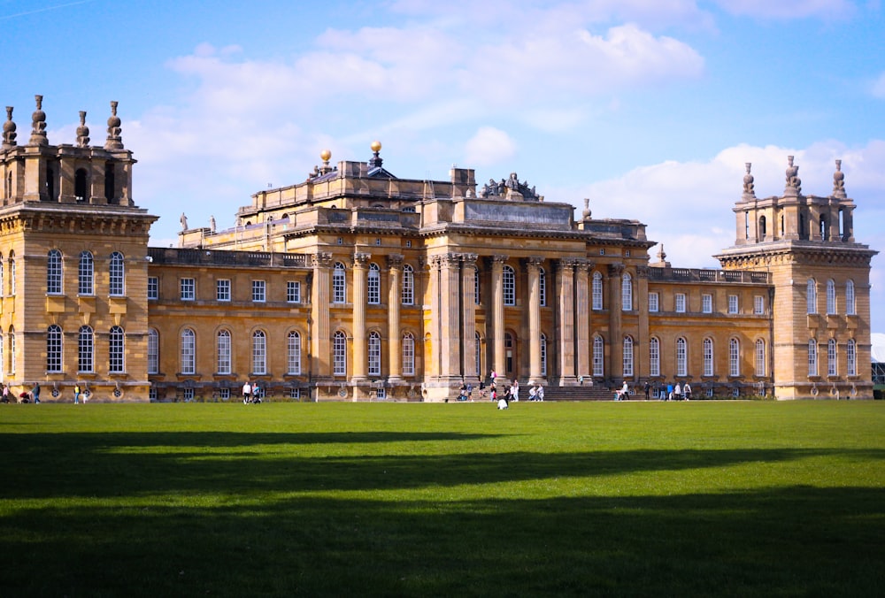 a large building with a large lawn in front of it