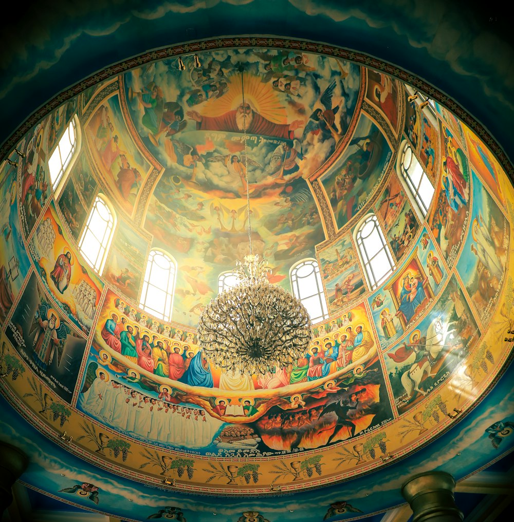 the ceiling of a church with paintings on it