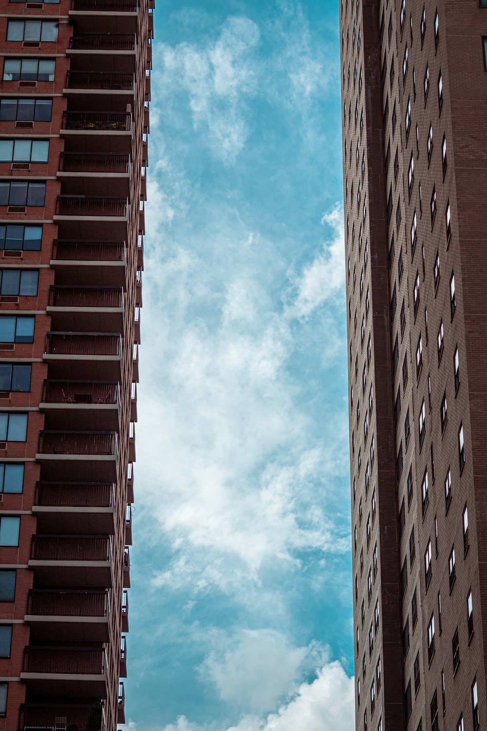 a couple of tall buildings sitting next to each other