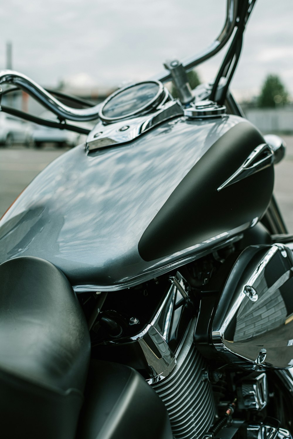 a close up of a motorcycle with a sky background