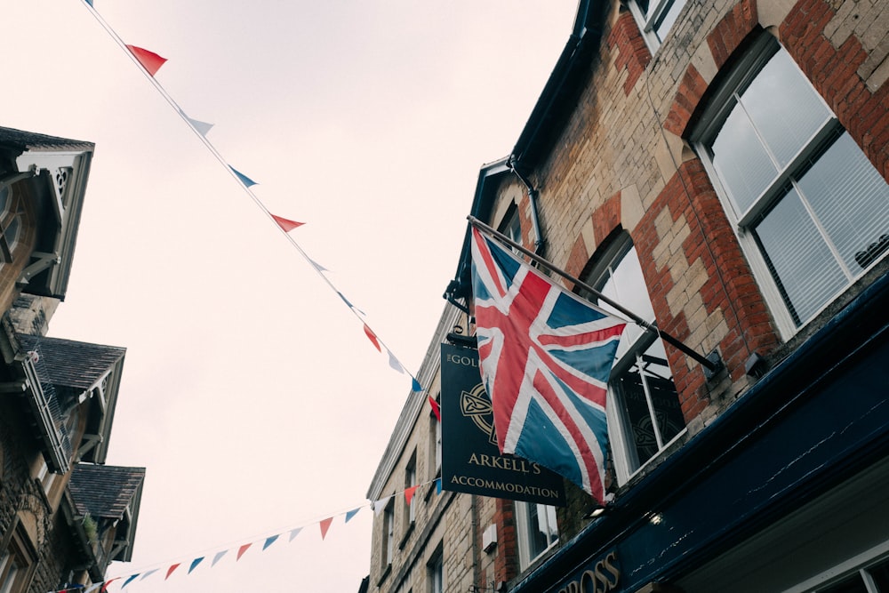 a british flag hanging from the side of a building