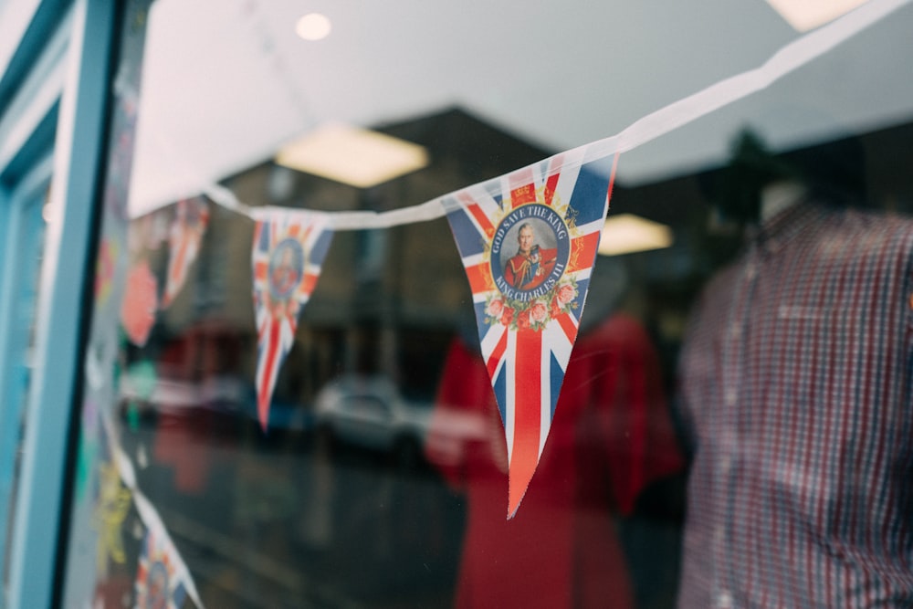 a british flag hanging from a store window