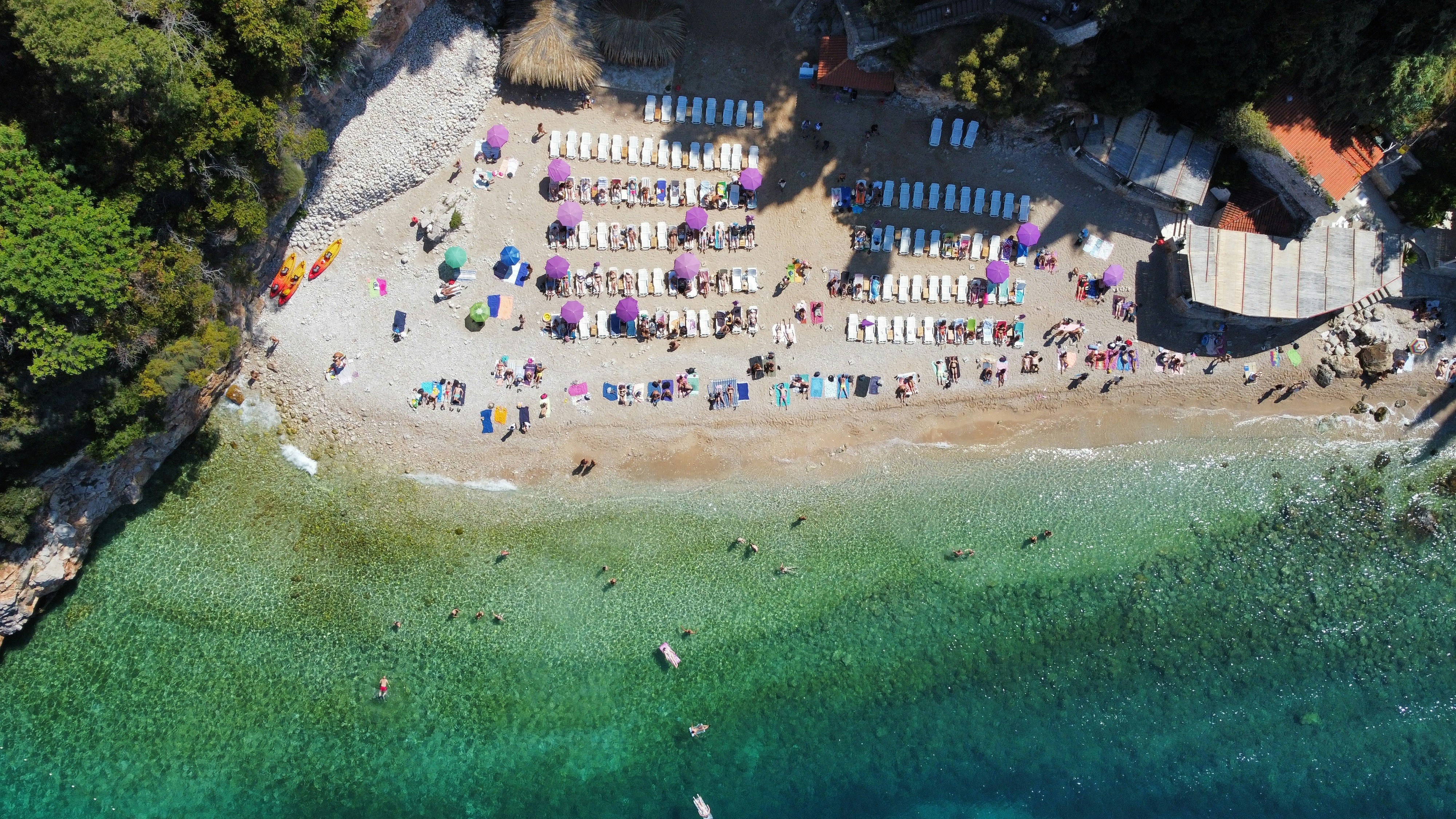 An aerial view of a beach with a lot of people