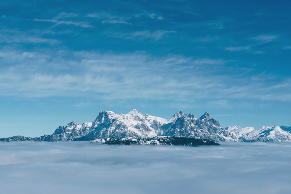 a view of a mountain range in the clouds