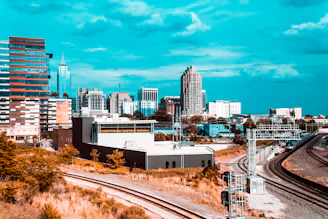 a view of a city from a train track