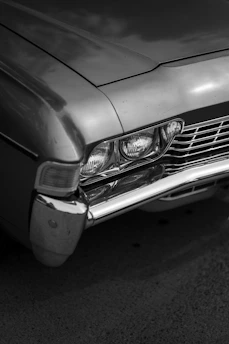 Before and after image showing a car’s plastic bumper restored from dull to glossy finish.