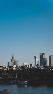 A modern cityscape featuring a mix of new build developments and converted historic buildings under a clear sky.