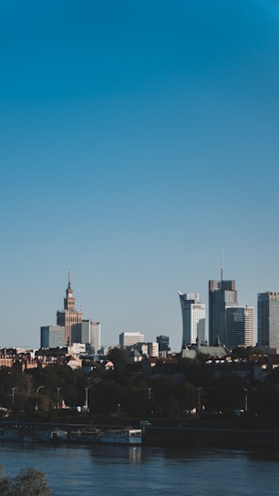 A modern cityscape featuring a mix of new build developments and converted historic buildings under a clear sky.