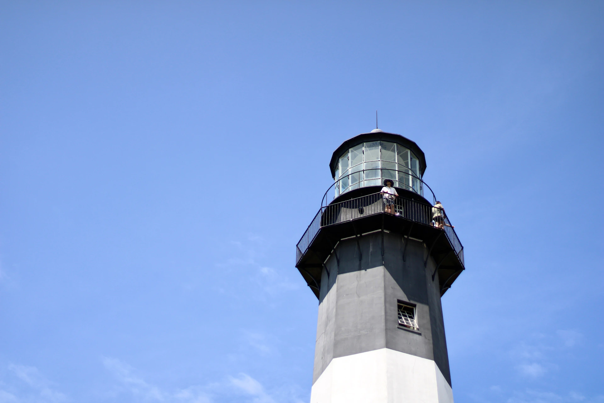 a light house with a blue sky in the background