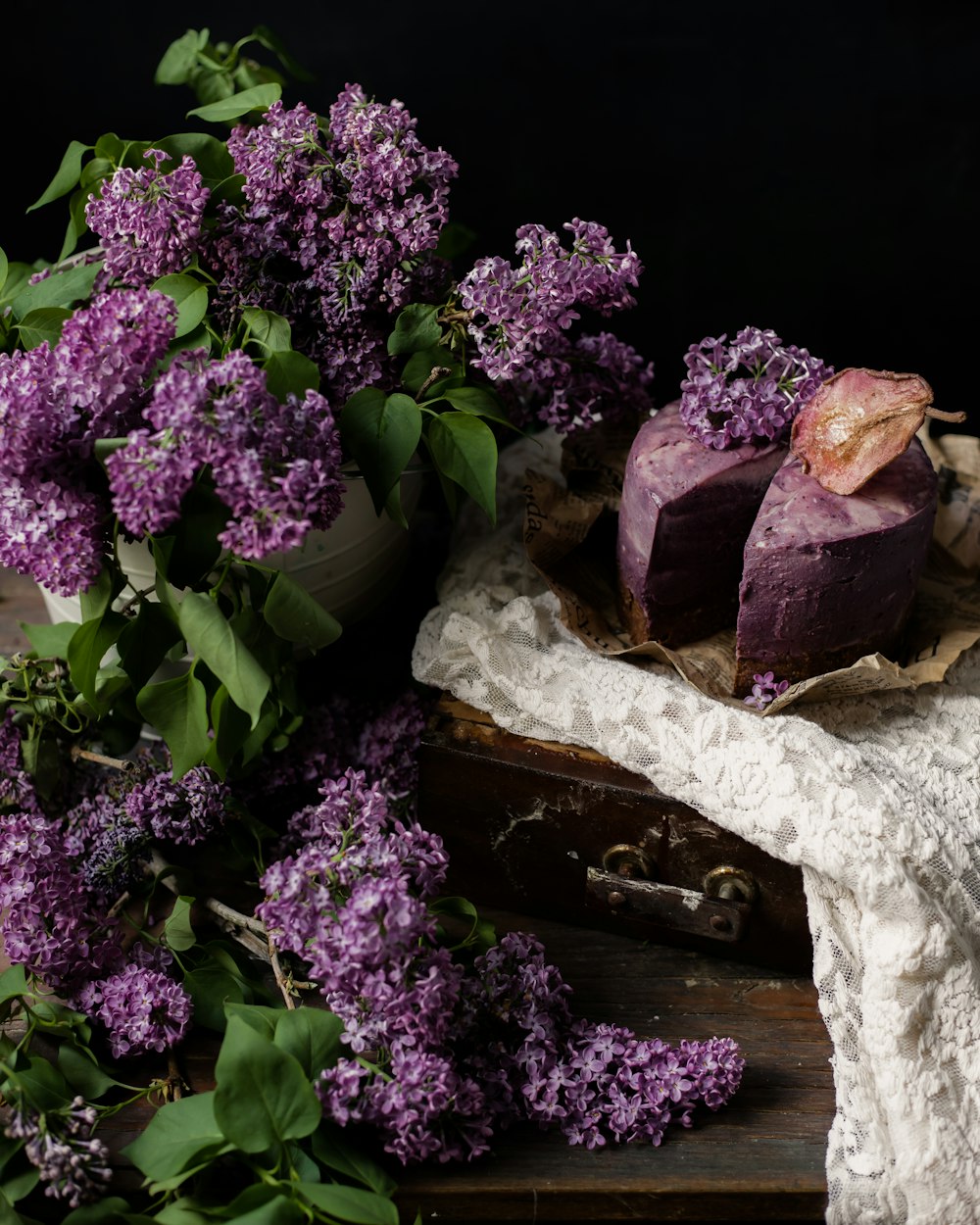 a bunch of purple flowers sitting on top of a table