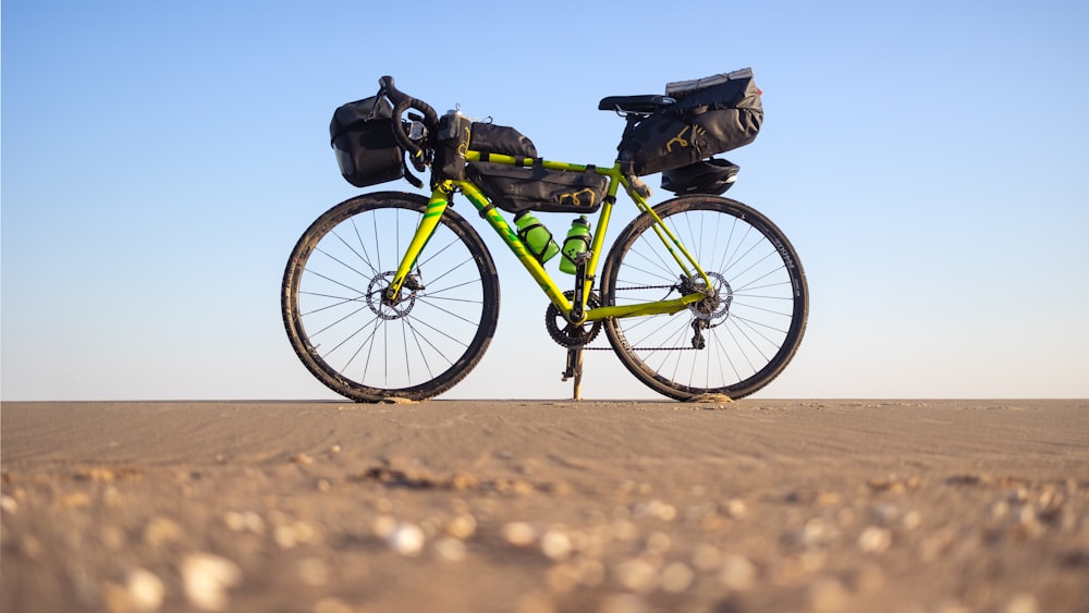 a bike with a bunch of bags on the back of it