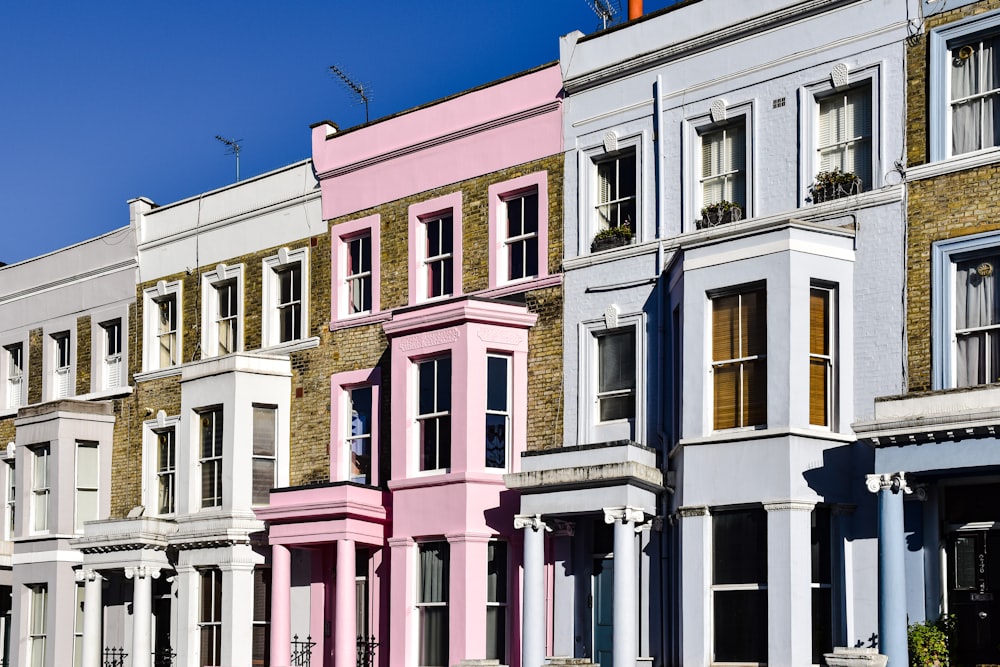 a row of multi - colored buildings in a city