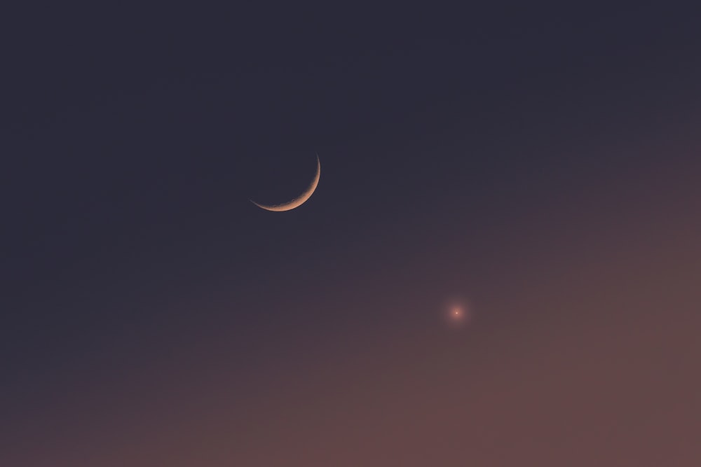 two crescents are seen in the night sky