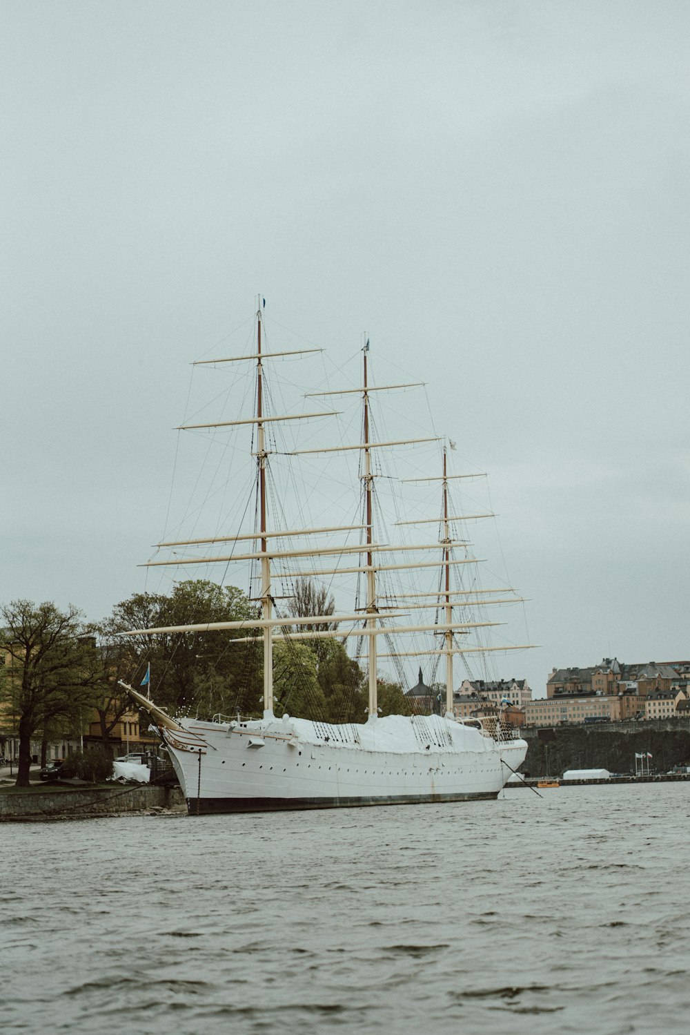 a large white boat floating on top of a body of water