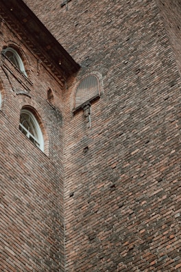 A completed masonry wall with intricate designs.