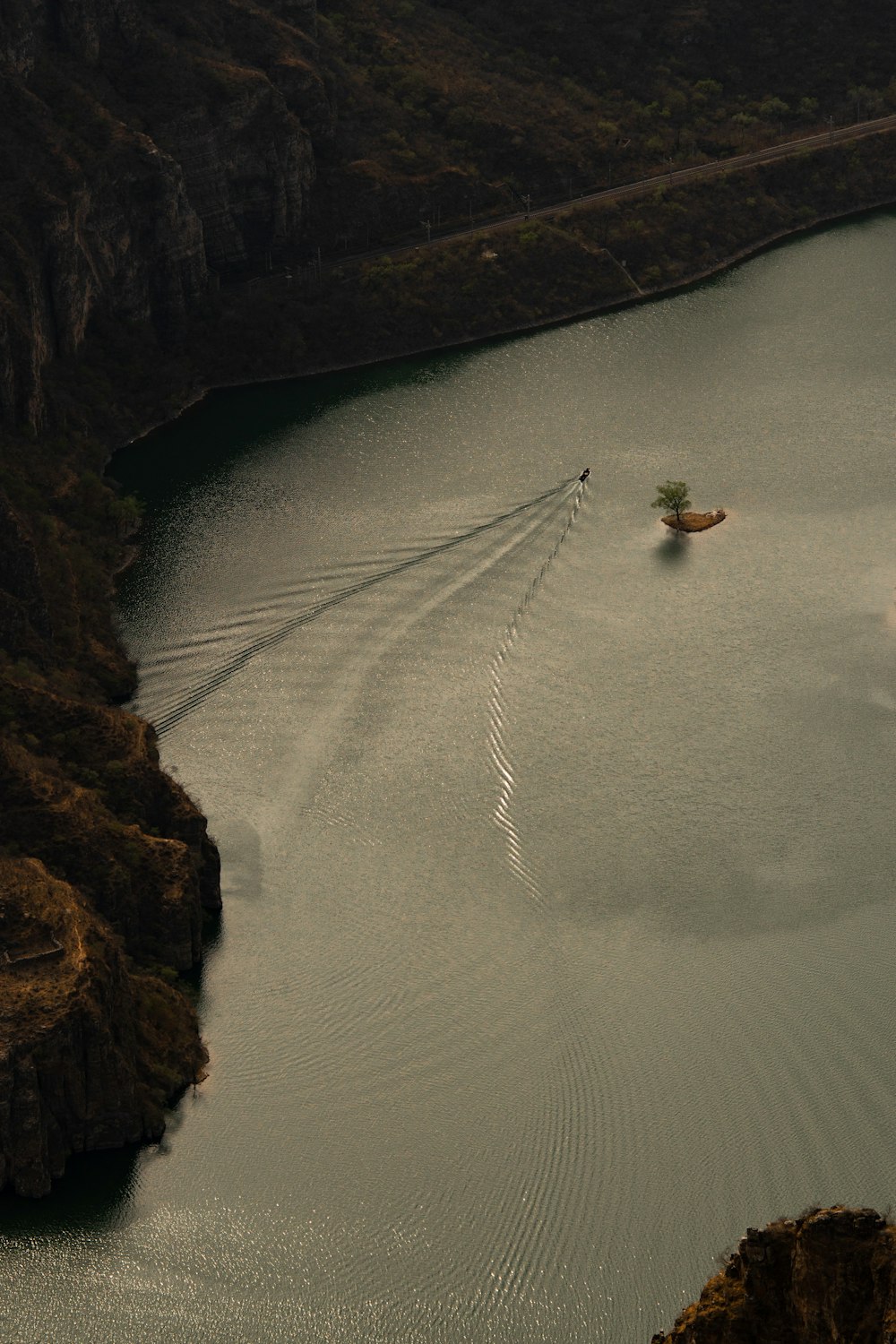 a boat traveling across a large body of water