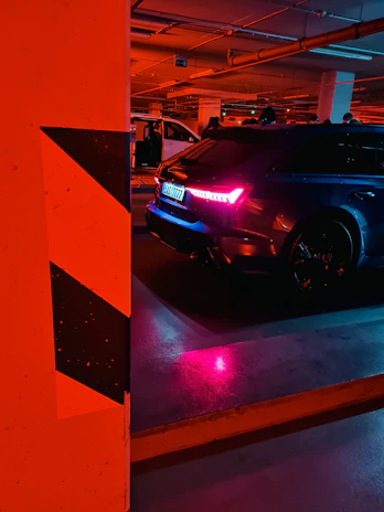 A set of vibrant LED car lights glowing vividly against a dark garage backdrop.