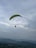 A breathtaking view from a paraglider soaring above the hills.