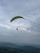 A breathtaking view from a paraglider soaring above the hills.