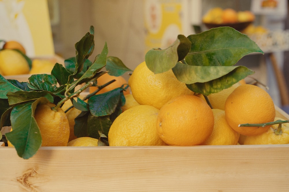 a wooden box filled with lots of oranges