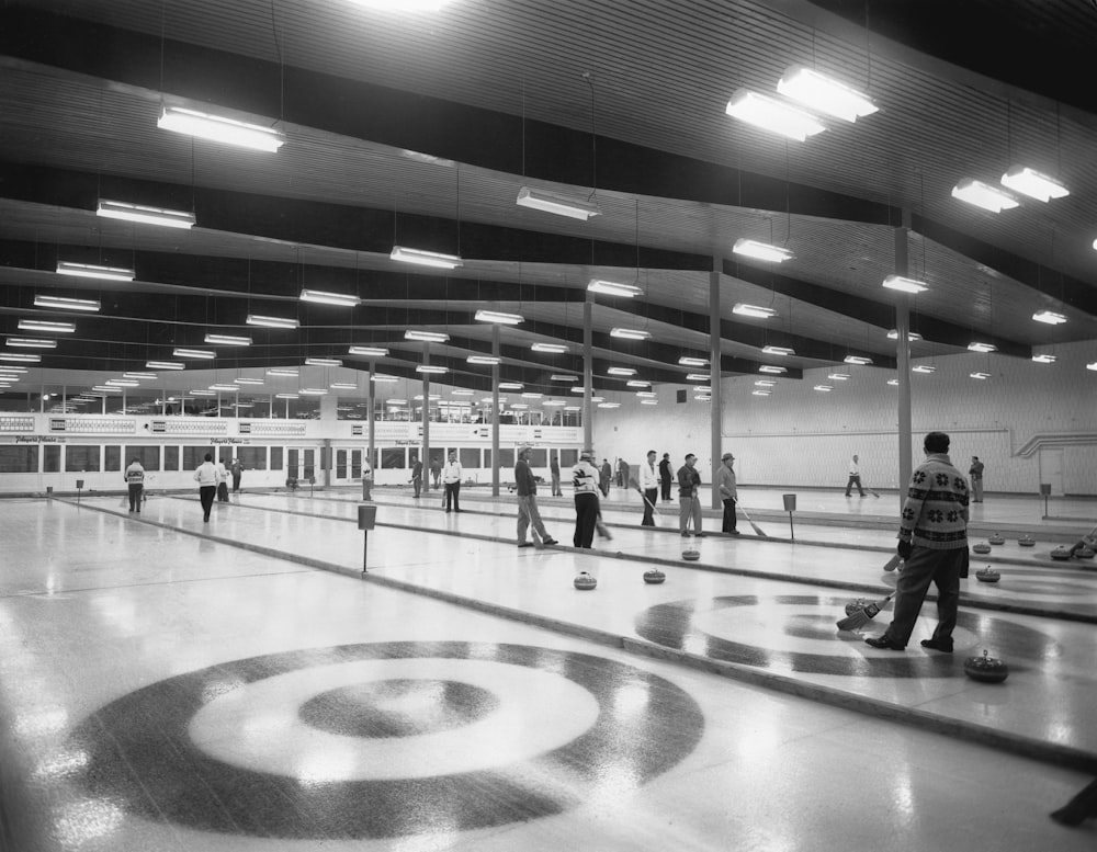 a black and white photo of a bowling alley