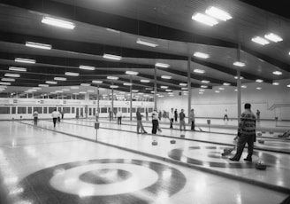 a black and white photo of a bowling alley