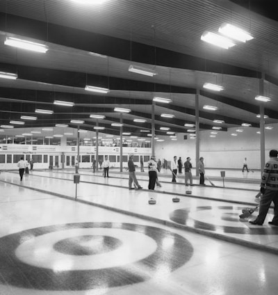 a black and white photo of a bowling alley