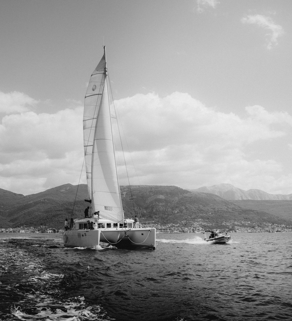 a sailboat sailing on a body of water