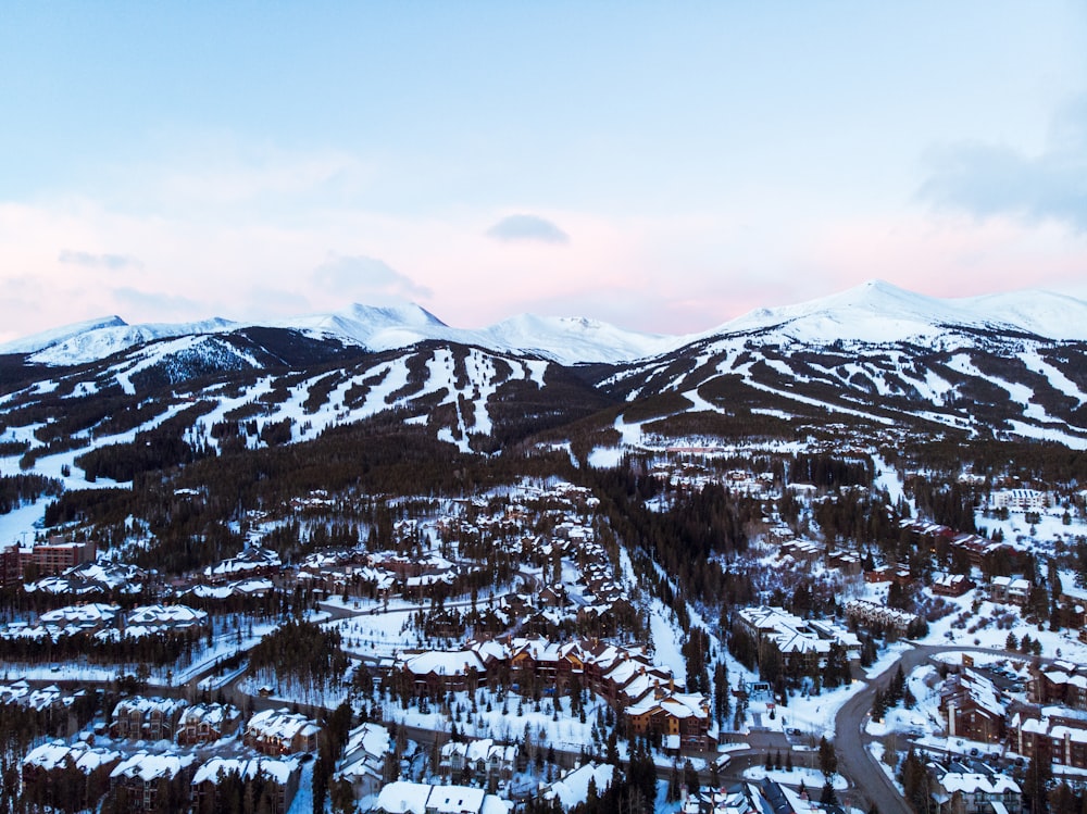 a view of a snowy mountain range from a helicopter