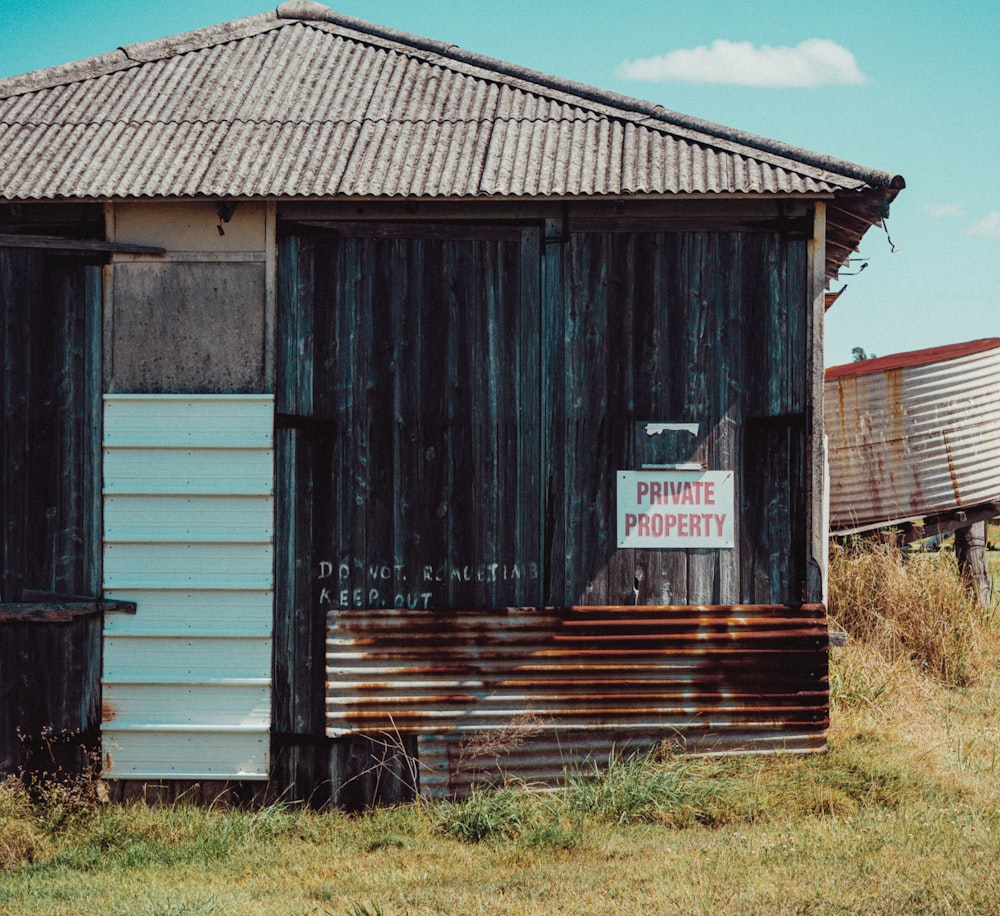 a rusted out building with a sign on it