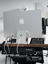 A tech influencer showcasing the latest gadget in a modern workspace.