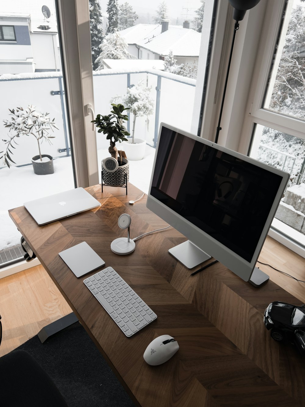 a desk with a computer, keyboard and mouse