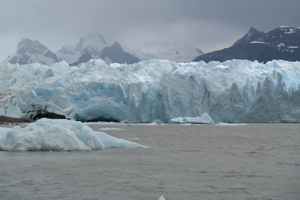 a large iceberg in the middle of a body of water