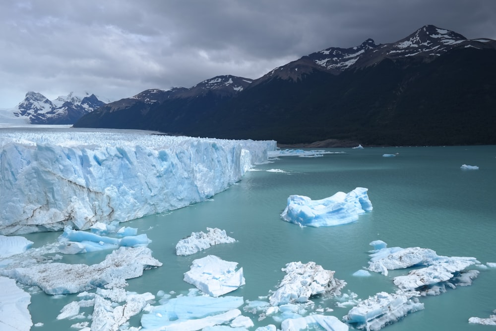 a large iceberg in the middle of a body of water