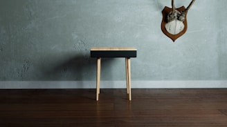 Finished wooden stool with smooth sanding and natural finish on display.