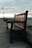 a wooden bench sitting next to the ocean