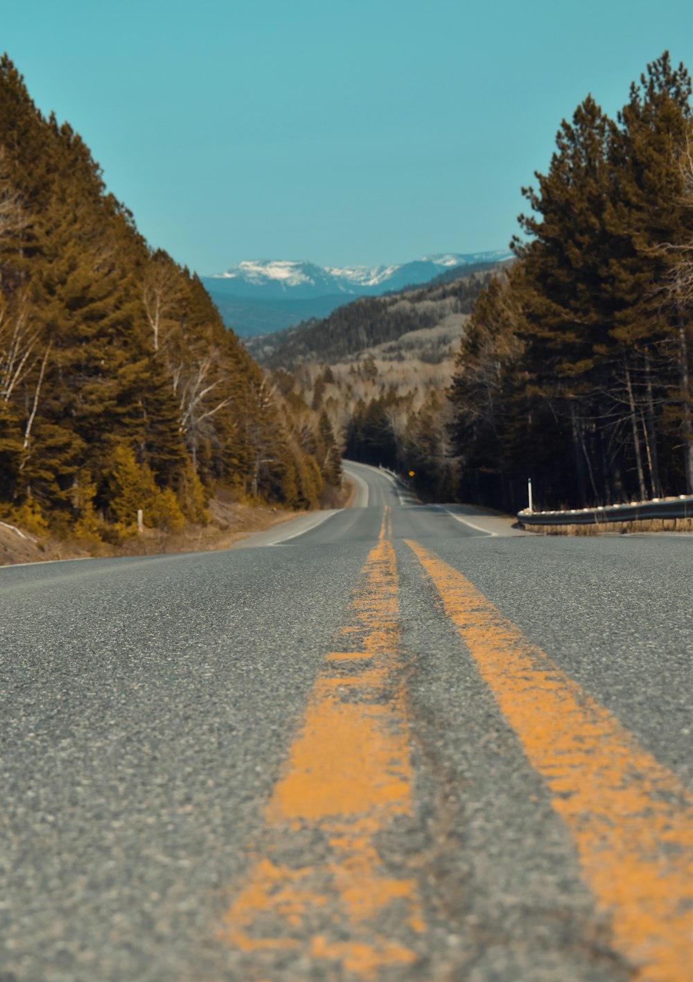 a road with a yellow line on the side of it