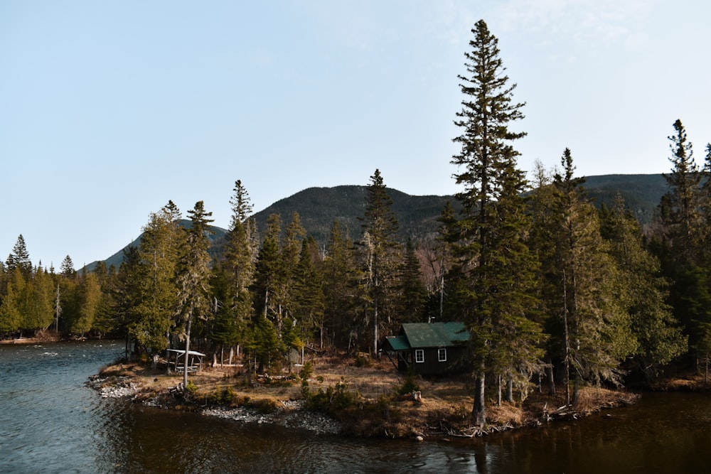 a small house on a small island in the middle of a lake