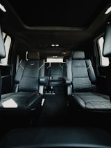 the interior of a vehicle with black leather seats