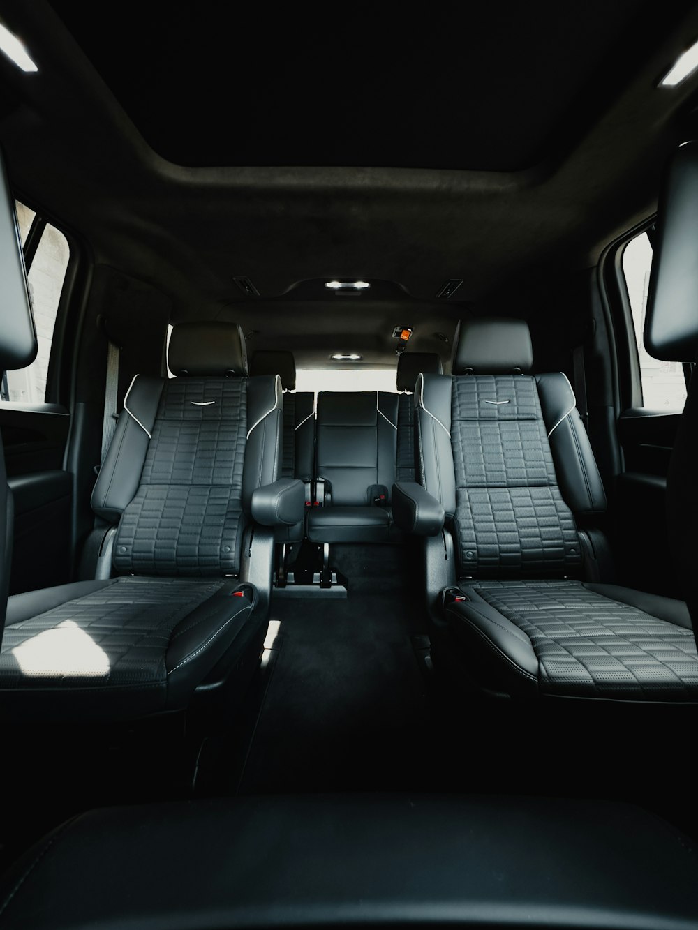 the interior of a vehicle with black leather seats