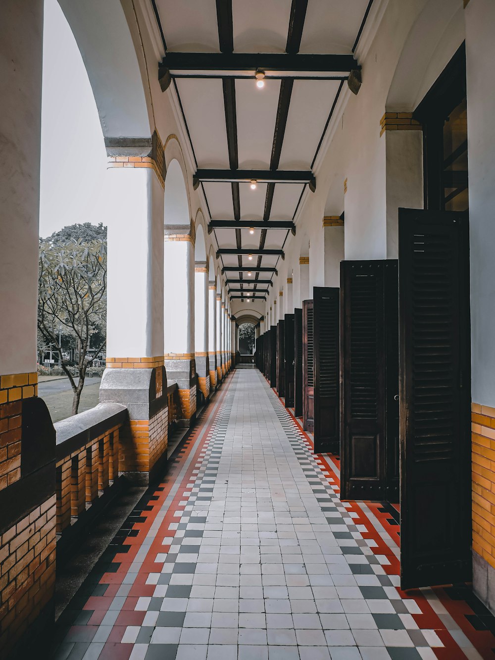 a long hallway with tiled floors and walls