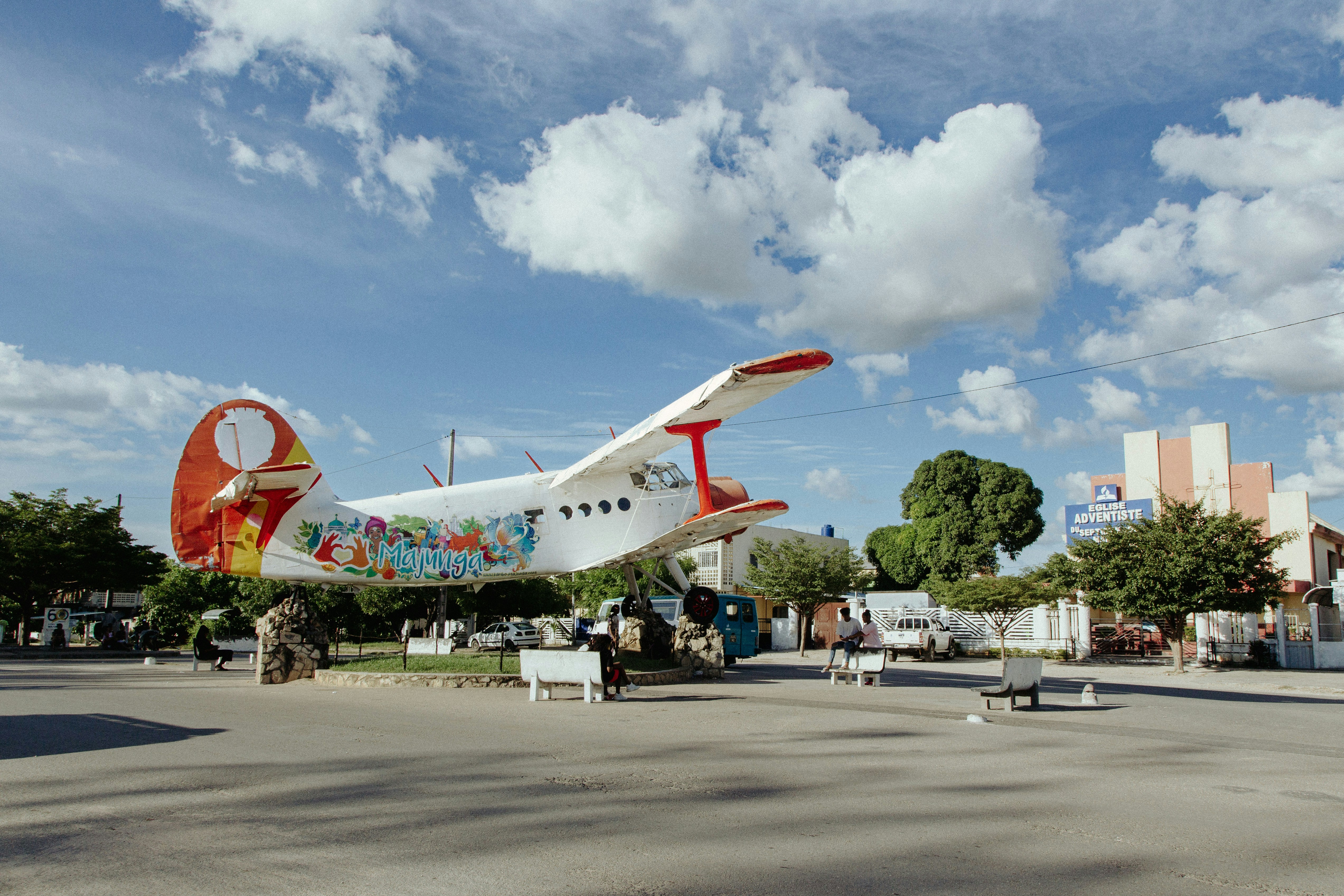 a small airplane is parked in a parking lot, 