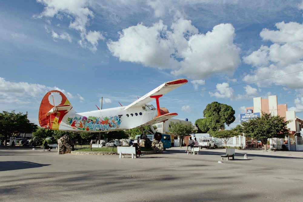 a small airplane is parked in a parking lot