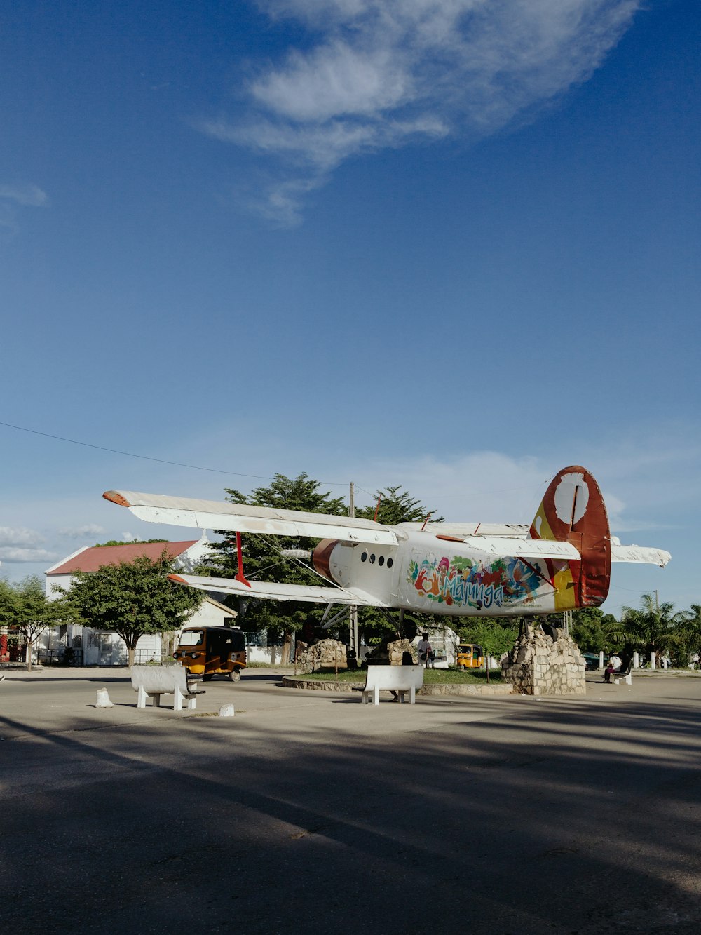 a plane with graffiti painted on the side of it