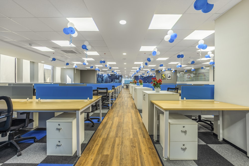 an empty office with blue and white decorations