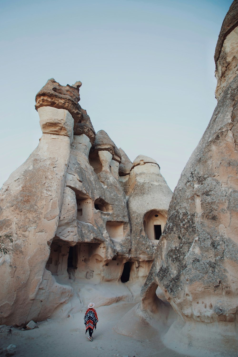 a person walking through a cave like area