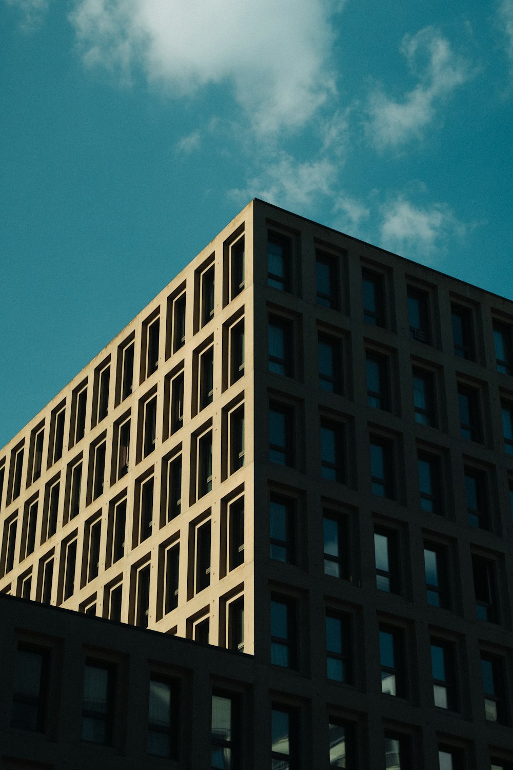 a very tall building with a clock on it's side