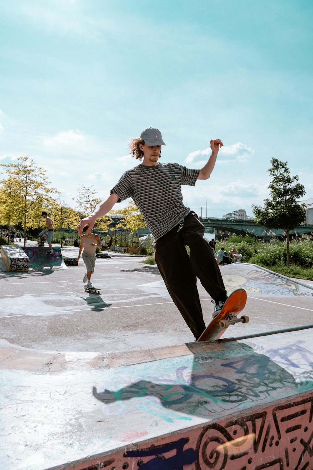 a man riding a skateboard on the side of a ramp