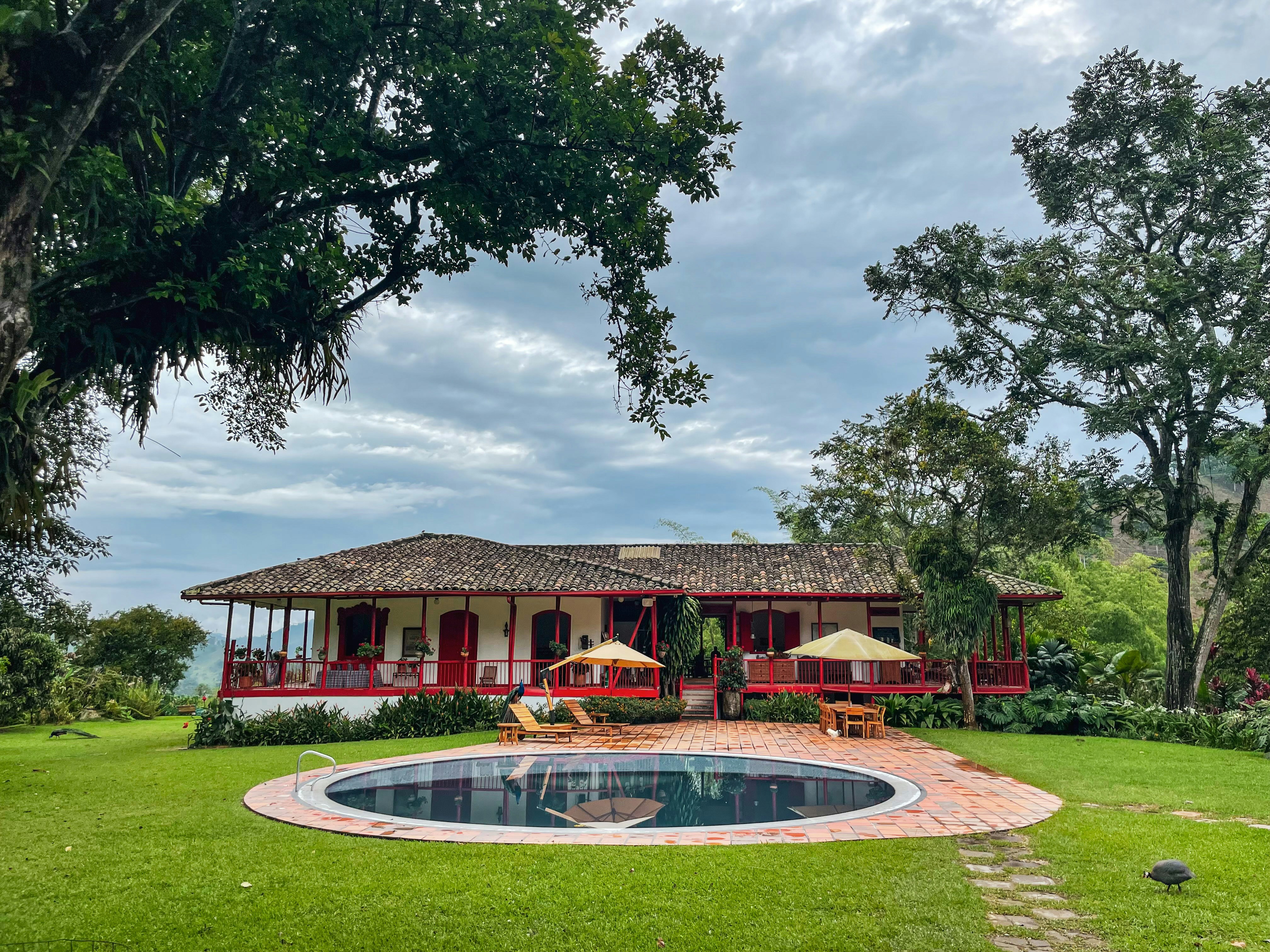 a house with a pool in front of it