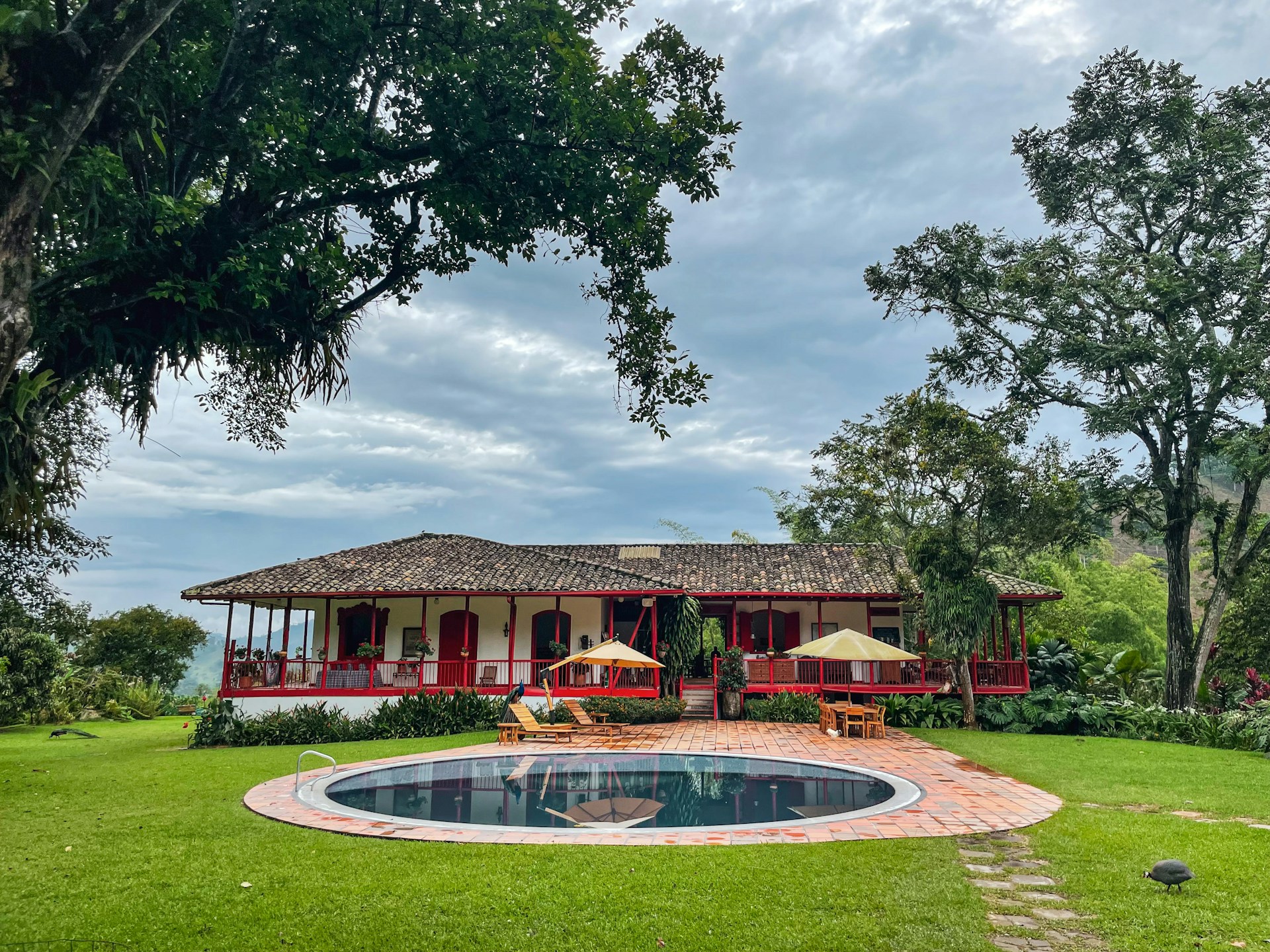 a house with a pool in front of it